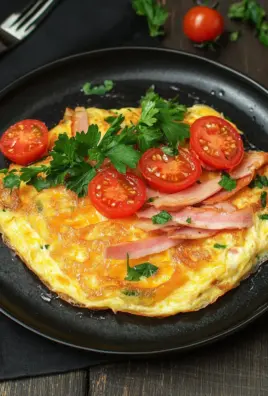Omelette mit Schinken, Käse und Tomaten